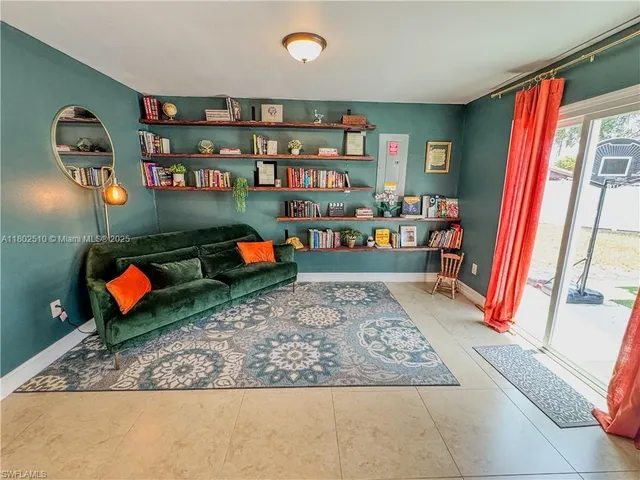 a living room with furniture and a rug