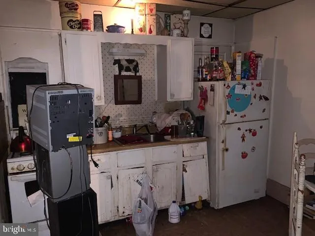 a view of storage and utility room with washer and dryer