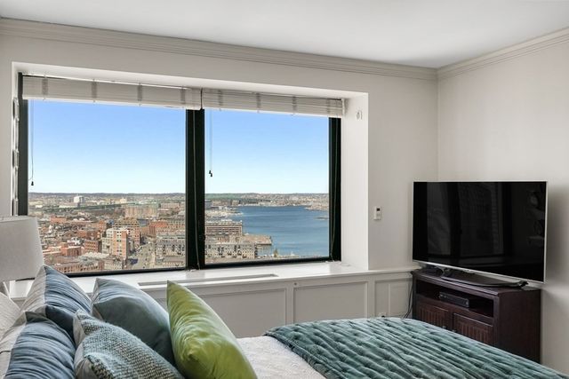 an aerial view of residential building and ocean view