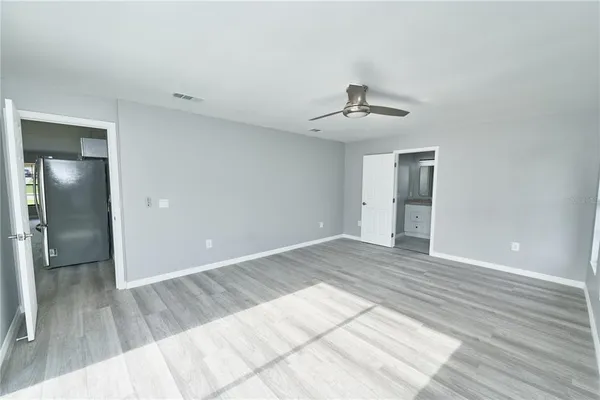 a view of an empty room with a window
