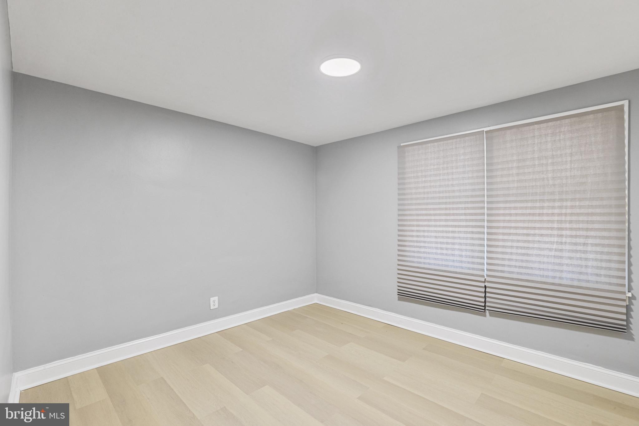 105 Upmanor Road Baltimore, MD 21229 - Photo 12 of 27 a view of a room with a empty space