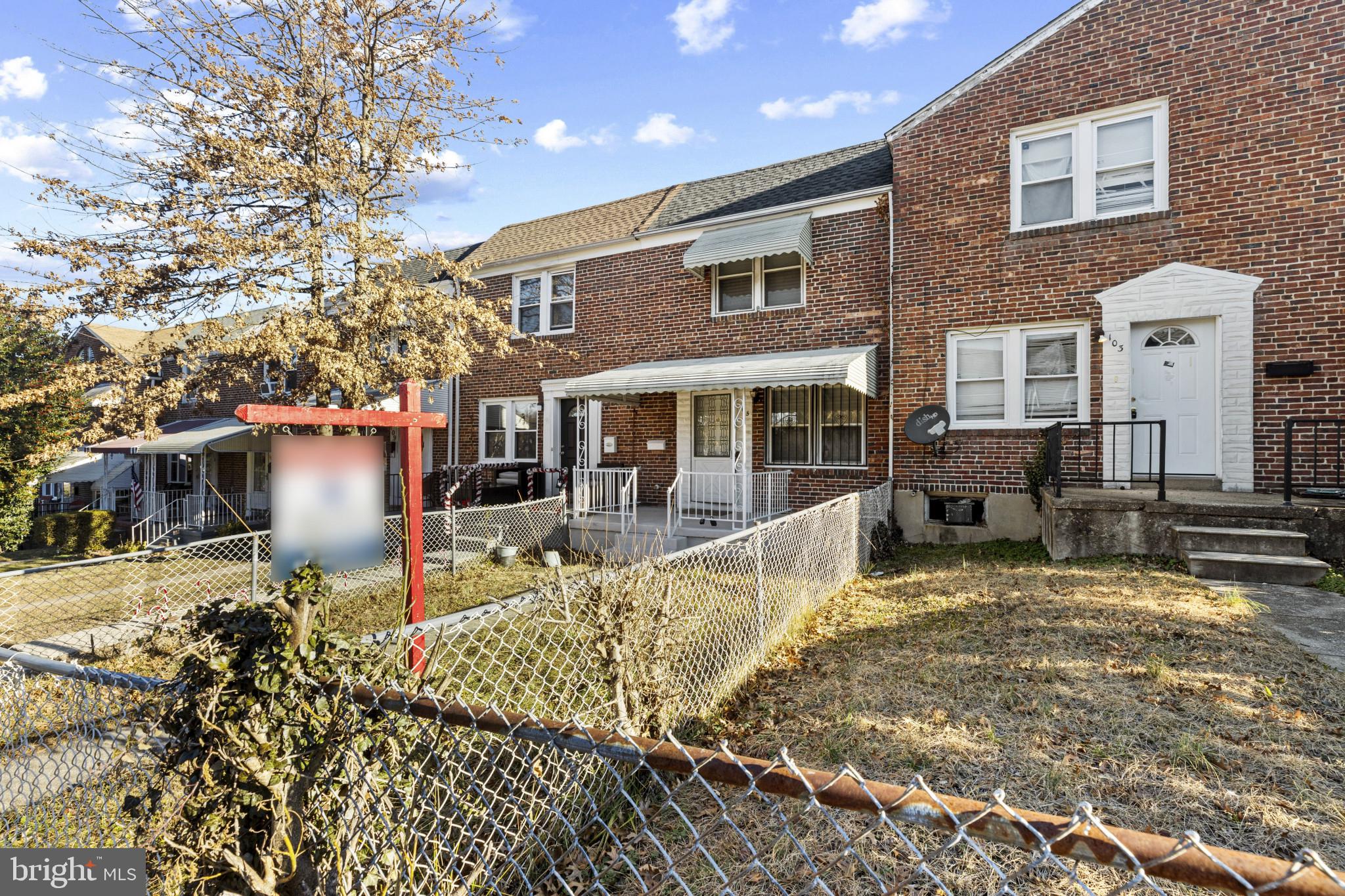 105 Upmanor Road Baltimore, MD 21229 - Photo 3 of 27 a front view of a house with garden