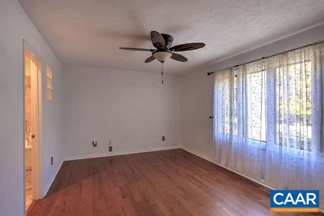 20 Begum Road Palmyra, VA 22963 - Photo 22 of 32 wooden floor in an empty room with a window