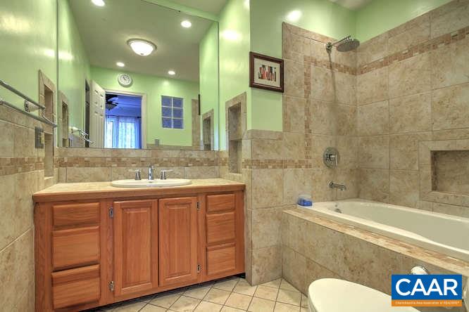 20 Begum Road Palmyra, VA 22963 - Photo 23 of 32 a bathroom with a granite countertop sink mirror vanity and toilet