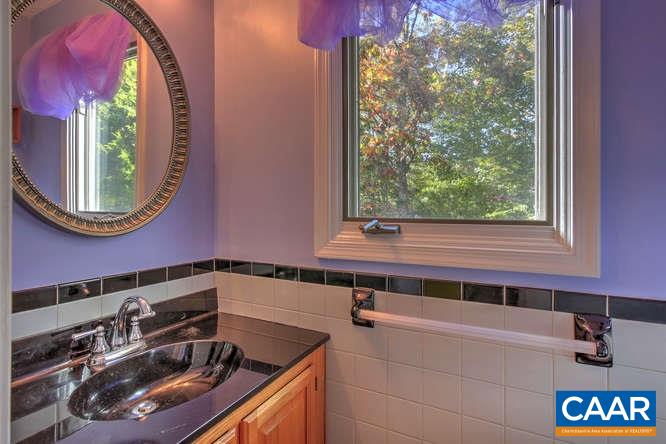 20 Begum Road Palmyra, VA 22963 - Photo 24 of 32 a bathroom with a sink and a mirror