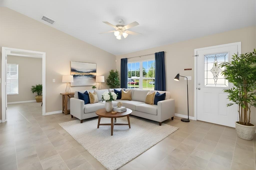 1 Pecan Course Circle Ocala, FL 34472 - Photo 7 of 24 a living room with furniture and a potted plant