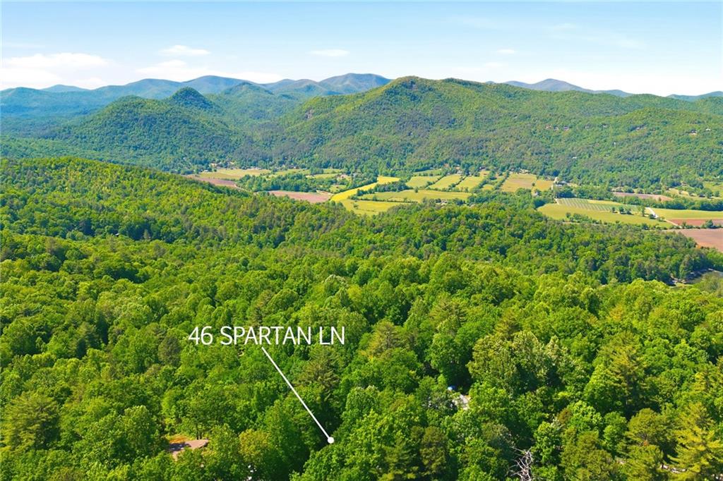 46 Spartan Lane Rabun Gap, GA 30568 - Photo 79 of 89 a view of a lush green hillside and houses
