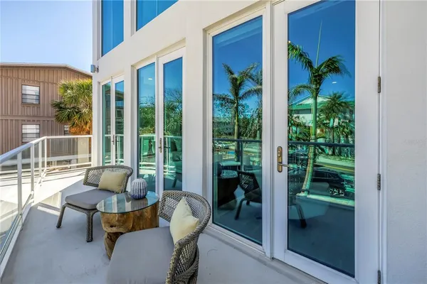a view of a dinning table and chairs in the patio