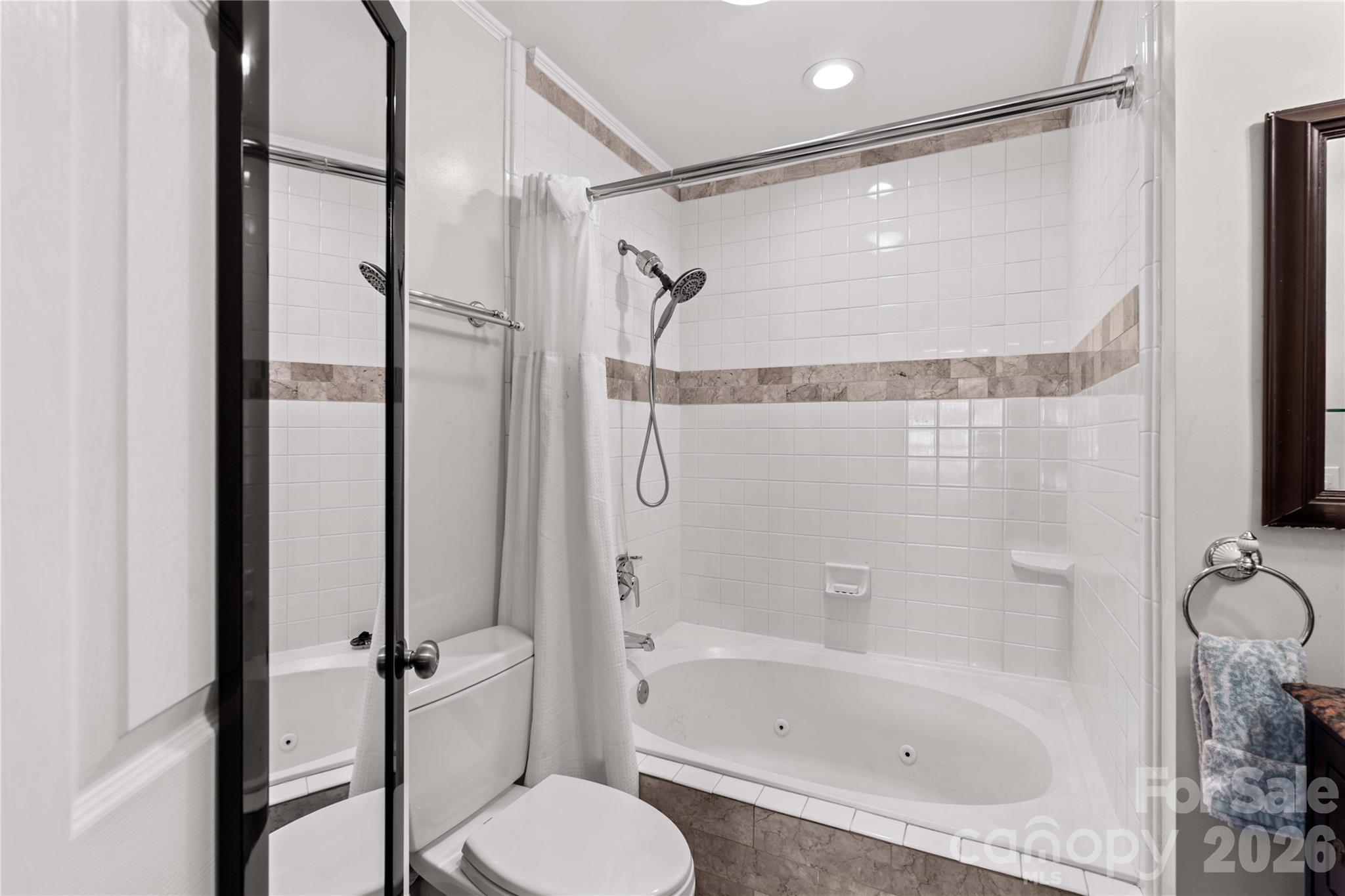 18797 Vineyard Point Lane Cornelius, NC 28031 - Photo 27 of 36 a bathroom with a shower and a toilet