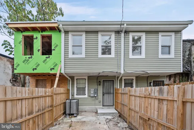 front view of a house with a large window
