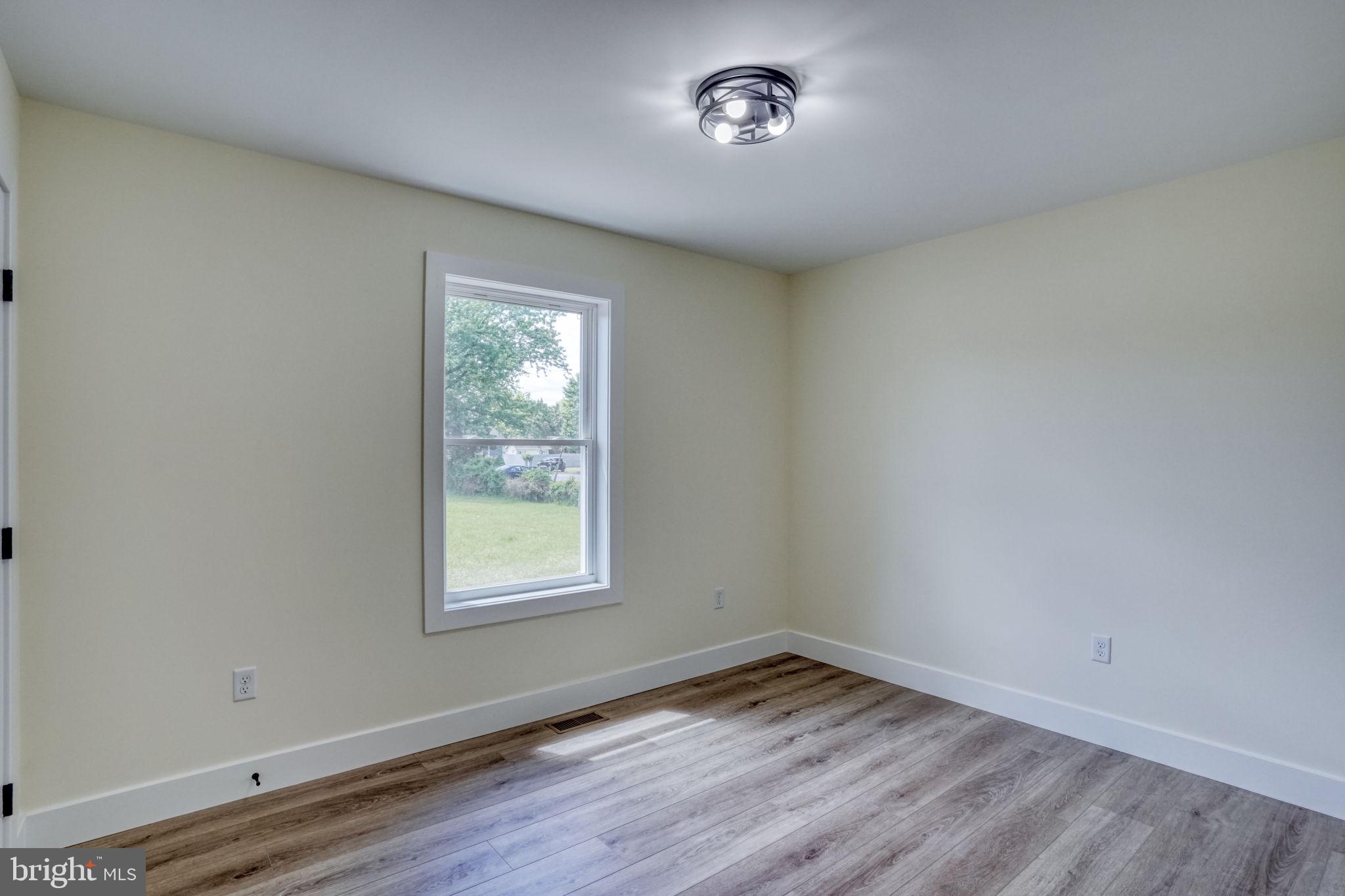 205 Charles Way Georgetown, DE 19947 - Photo 12 of 31 an empty room with a window