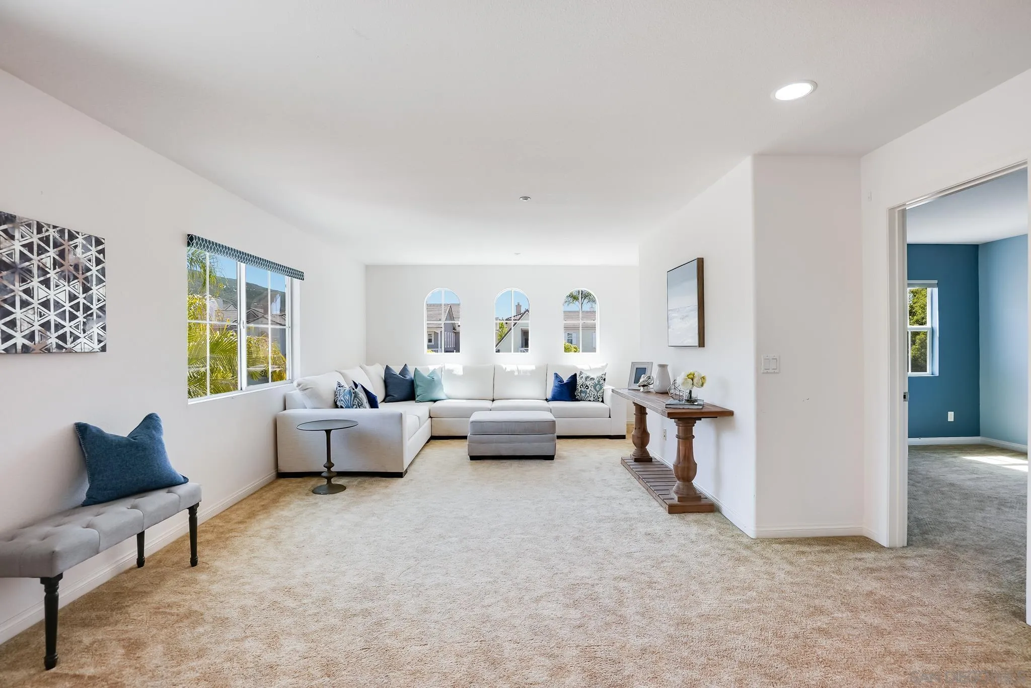 17048 Ralphs Ranch Road San Diego, CA 92127 - Photo 17 of 26 a living room with furniture and a couch