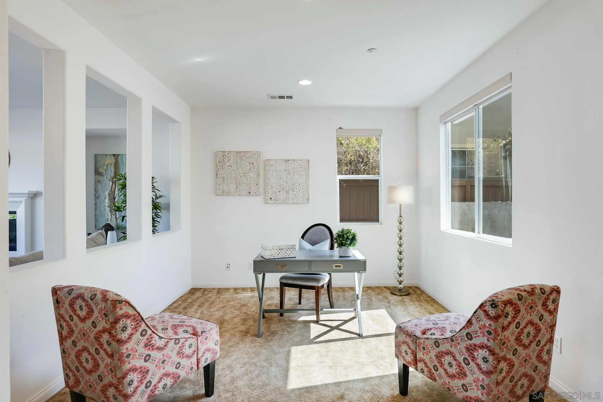 17048 Ralphs Ranch Road San Diego, CA 92127 - Photo 6 of 26 a living room with furniture and a potted plant