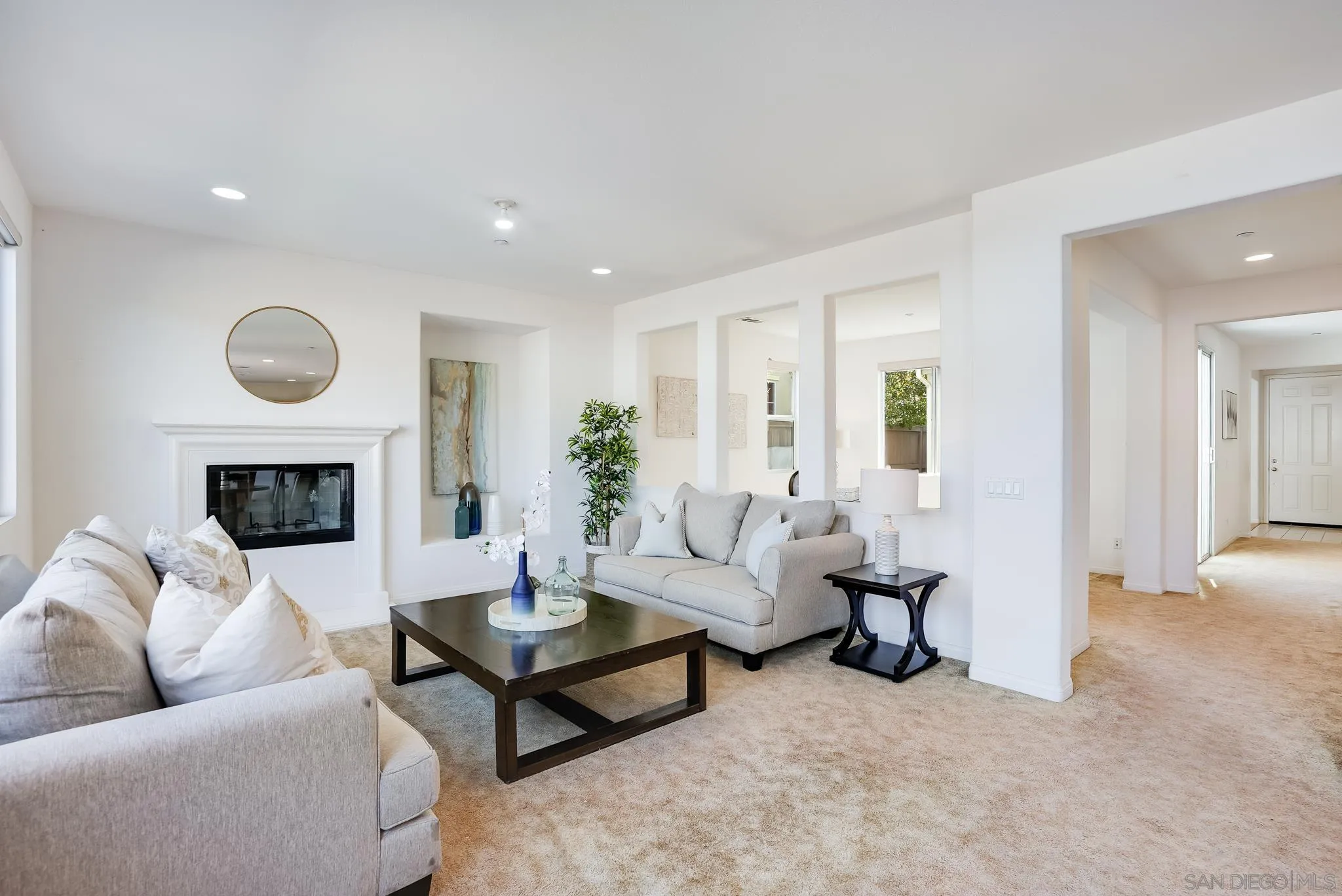 17048 Ralphs Ranch Road San Diego, CA 92127 - Photo 8 of 26 a living room with furniture and a fireplace