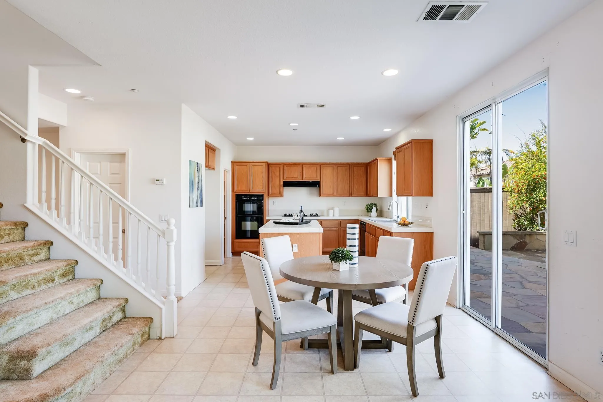 17048 Ralphs Ranch Road San Diego, CA 92127 - Photo 10 of 26 a view of a dining room with furniture