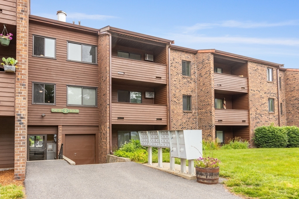 9 Davis Road, Unit C1 Acton, MA 01720 - Photo 17 of 20 a front view of a house with a yard