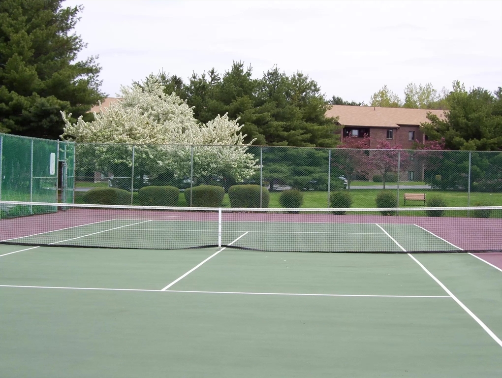 9 Davis Road, Unit C1 Acton, MA 01720 - Photo 4 of 20 a tennis court that has tennis net