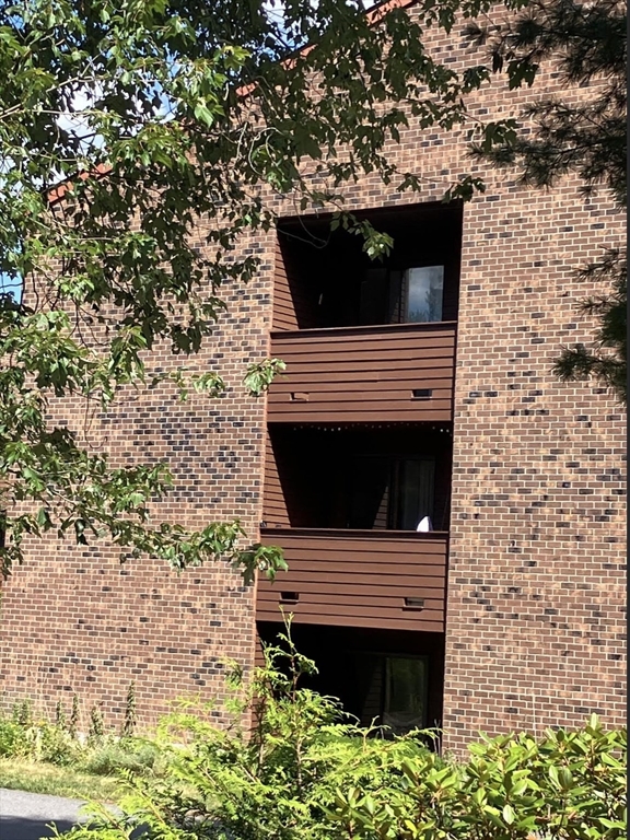 9 Davis Road, Unit C1 Acton, MA 01720 - Photo 5 of 20 a view of a barbeque grill with a small yard