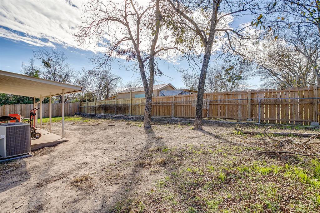 610 North Mesquite Hico, TX 76457 - Photo 31 of 34 a view of a yard with a large tree in it