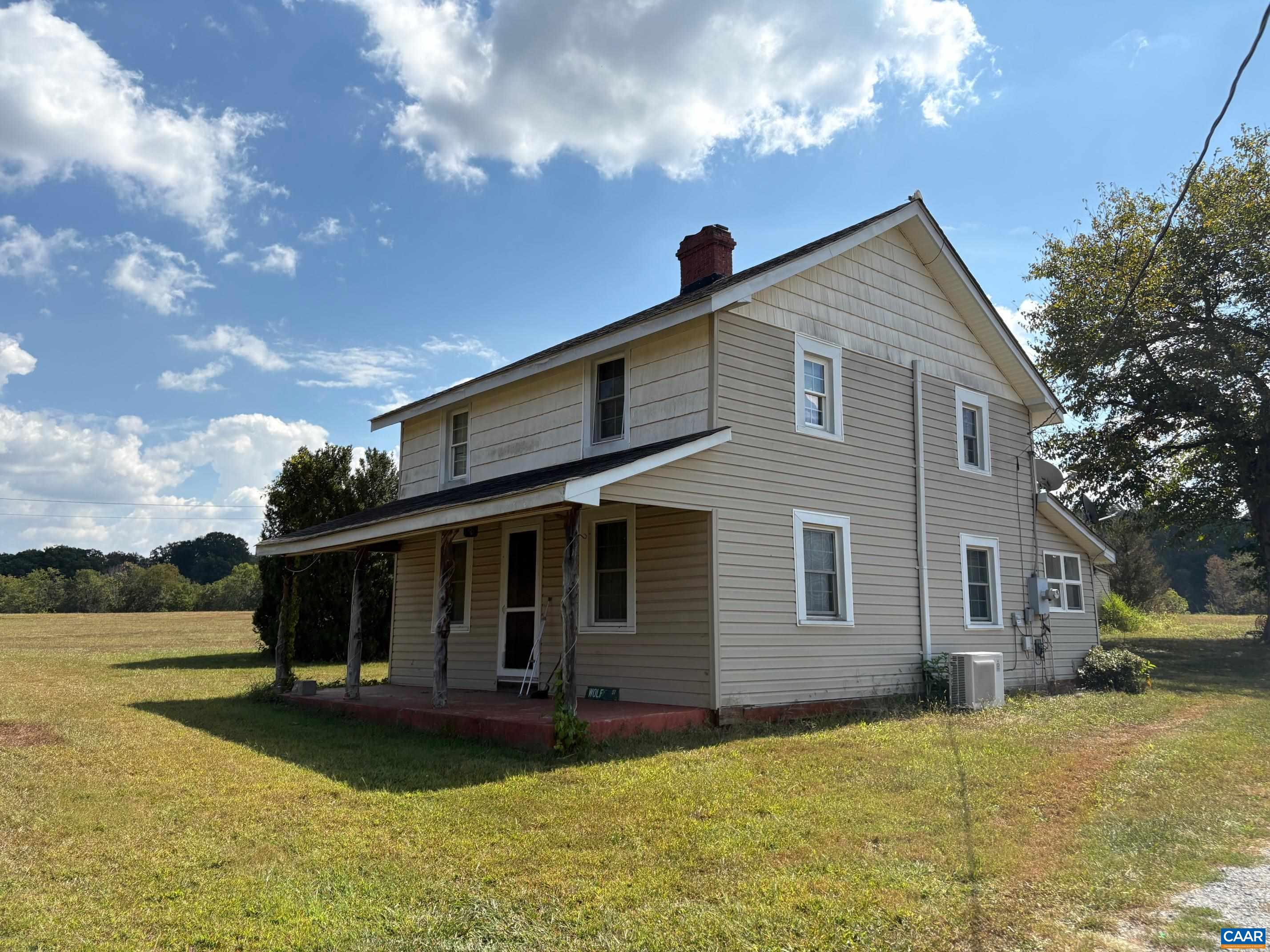 5912-5928 Hoover Road West Reva, VA 22735 - Photo 2 of 10 a front view of a house with garden