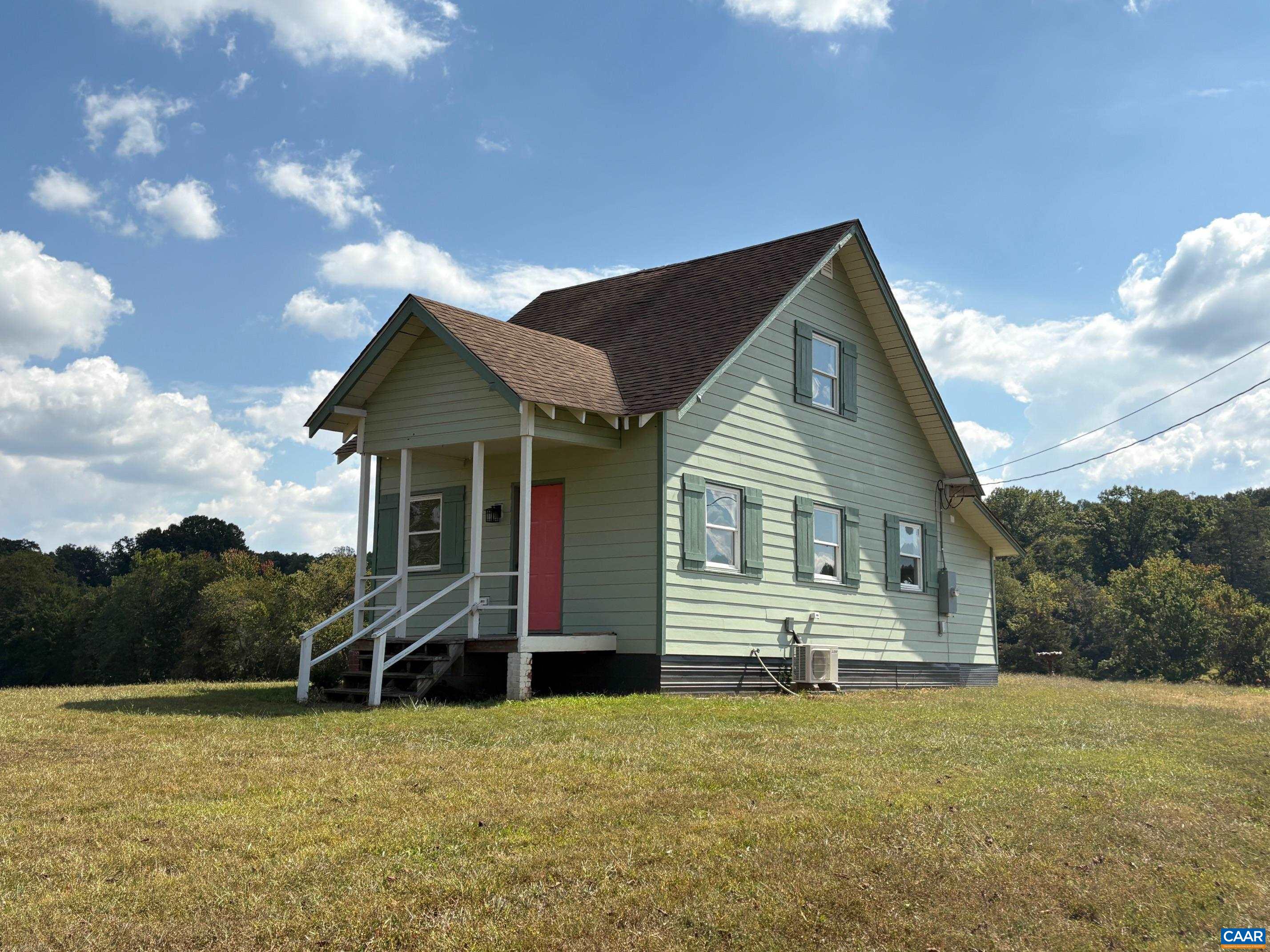 5912-5928 Hoover Road West Reva, VA 22735 - Photo 3 of 10 a front view of house with yard and trees in the background