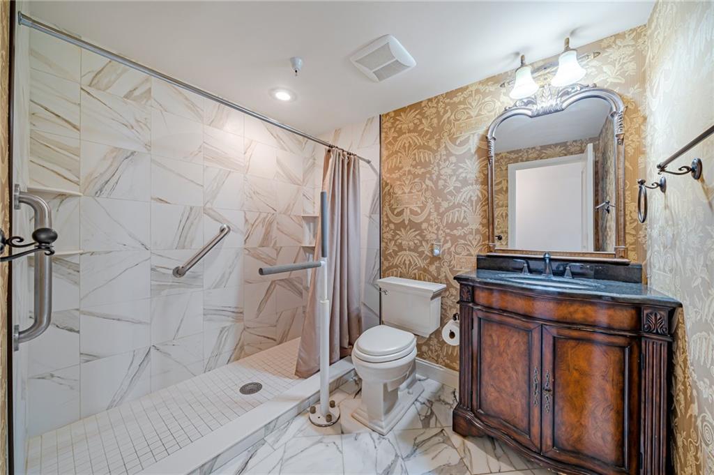 750 Washington Road, Unit 211 Pittsburgh, PA 15228 - Photo 14 of 19 a bathroom with a granite countertop sink toilet and shower