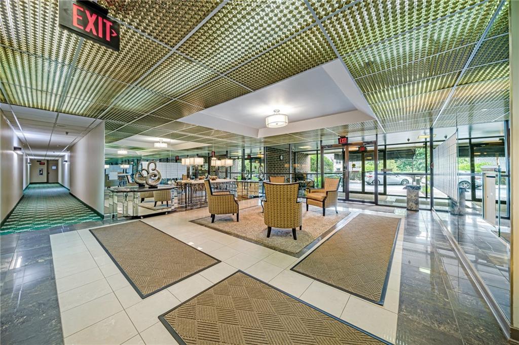 750 Washington Road, Unit 211 Pittsburgh, PA 15228 - Photo 16 of 19 a view of a patio with a table and chairs