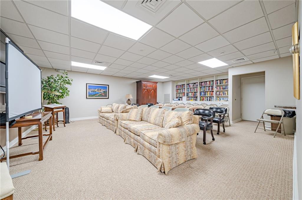 750 Washington Road, Unit 211 Pittsburgh, PA 15228 - Photo 18 of 19 a living room with furniture and a large window