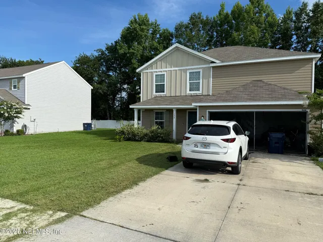 a car parked in front of a house