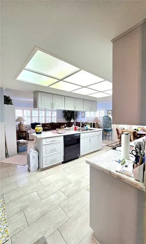 a kitchen with counter top space a sink and cabinets
