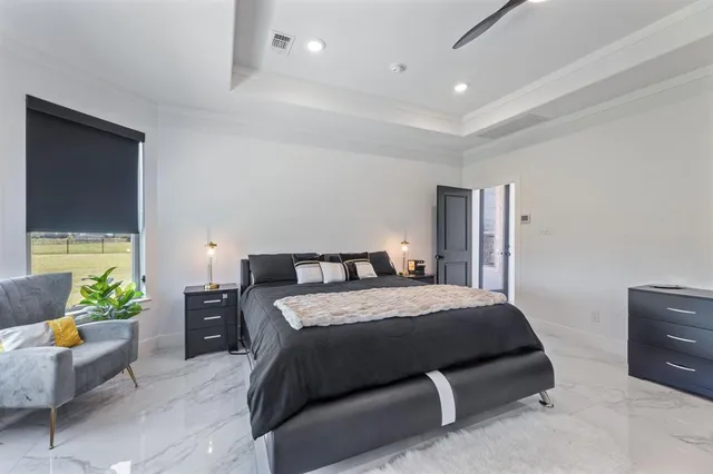 a bedroom with a bed and a couch