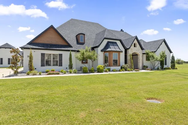 a front view of house with outdoor seating