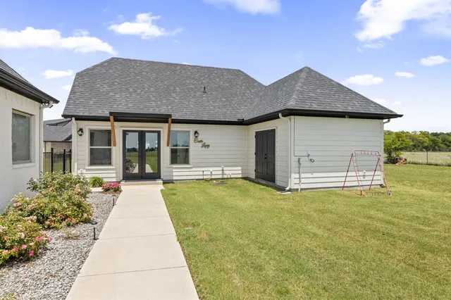 a front view of a house with a yard