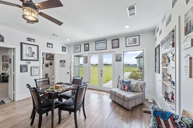 a view of a dining room with furniture and a potted plant