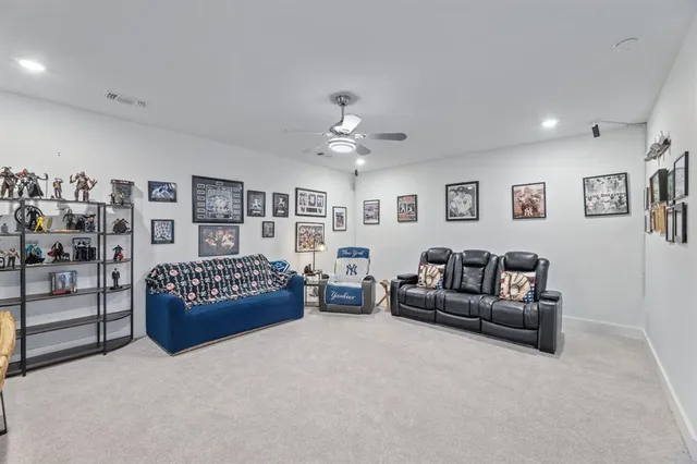 a living room with furniture and white walls