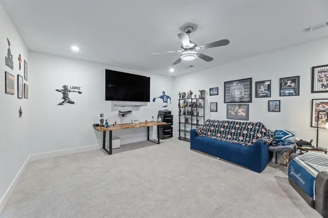 a bedroom with furniture and a flat screen tv