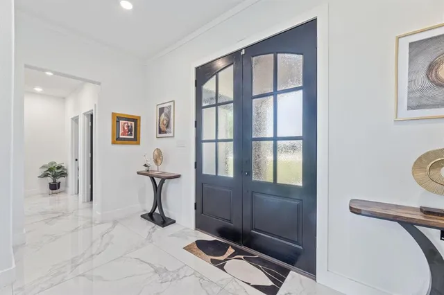 a room with gym equipment and a large window