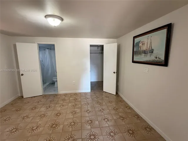 an empty room with a bathroom
