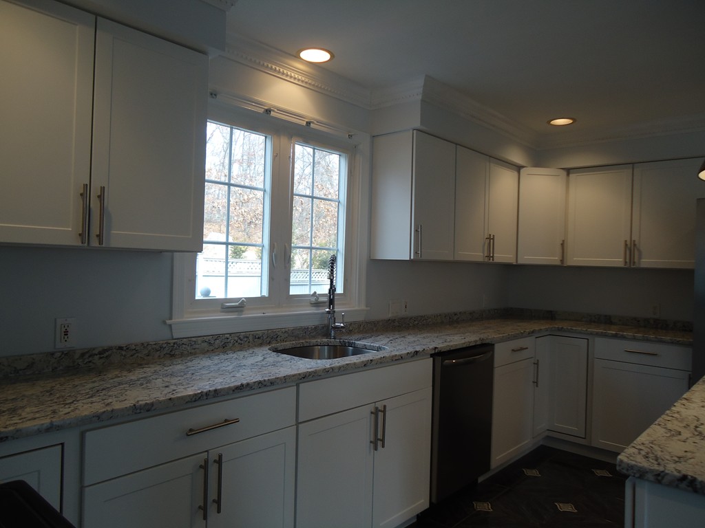 43 Parkland Road Needham, MA 02494 - Photo 15 of 30 a kitchen with granite countertop sink a window and a counter