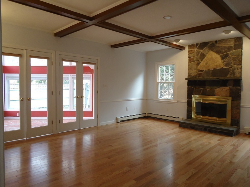 43 Parkland Road Needham, MA 02494 - Photo 17 of 30 a view of an empty room with wooden floor and a window