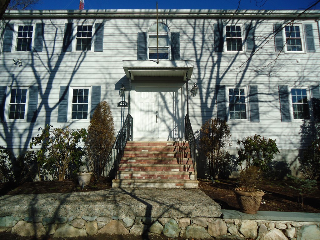 43 Parkland Road Needham, MA 02494 - Photo 2 of 30 a front view of a house with a yard