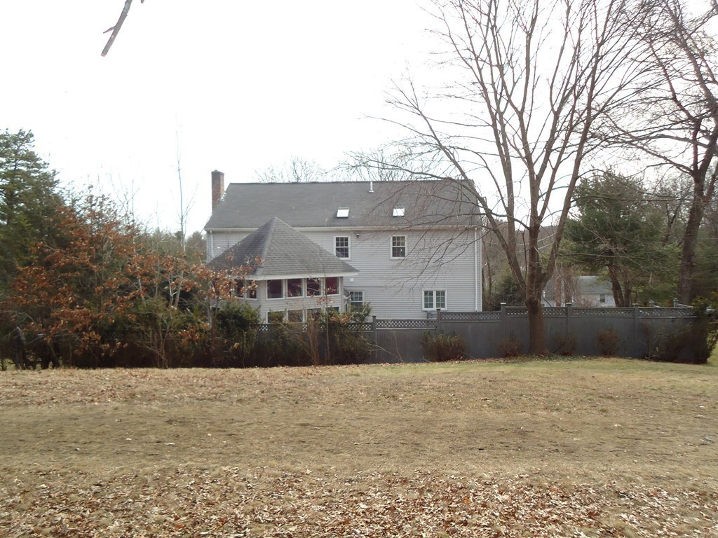 43 Parkland Road Needham, MA 02494 - Photo 30 of 30 a front view of house with yard covered with trees