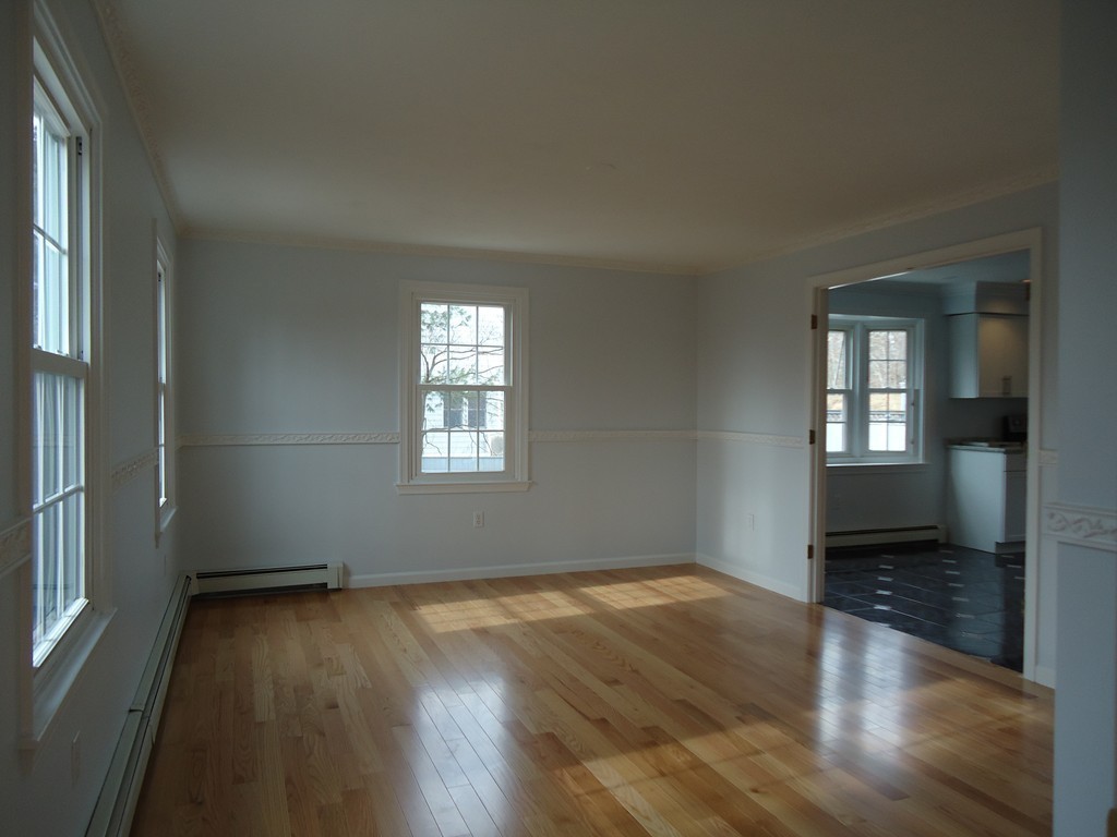 43 Parkland Road Needham, MA 02494 - Photo 7 of 30 an empty room with wooden floor and windows