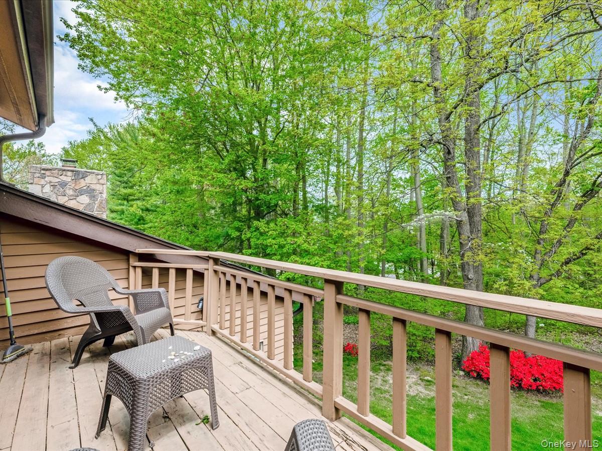 54 Harvard Road, Unit 54 Manhasset, NY 11030 - Photo 23 of 48 a view of a two chairs and table in the balcony