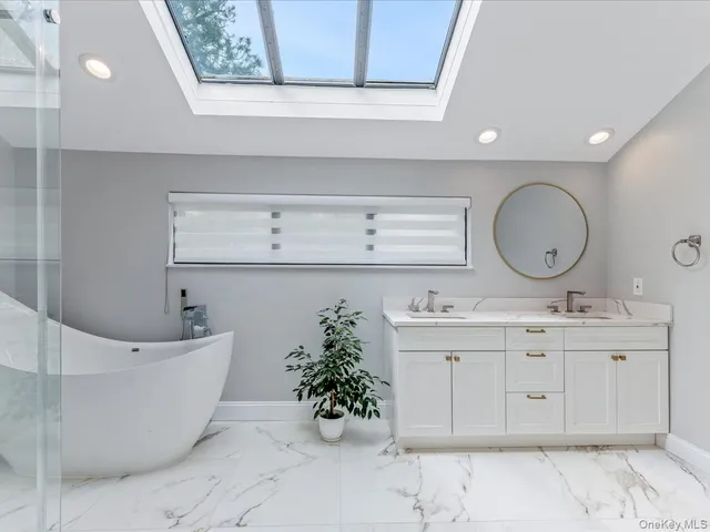 a bathroom with a bathtub and shower