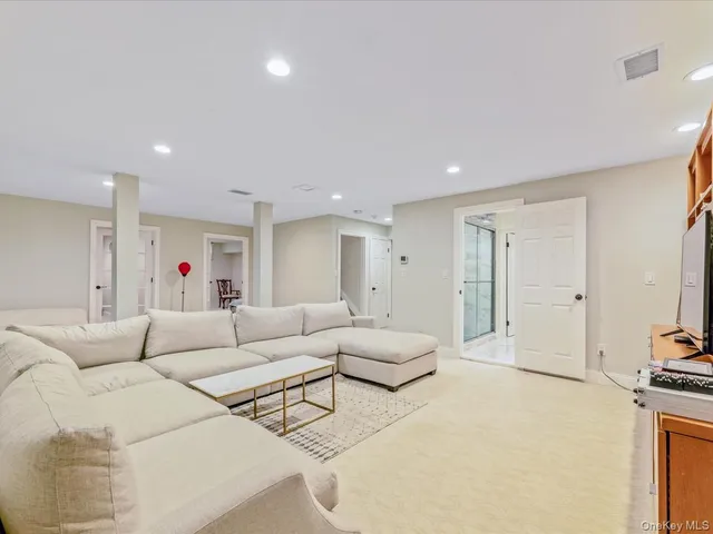 a bathroom with a granite countertop sink a mirror and a shower