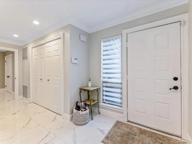 a view of a hallway with chairs