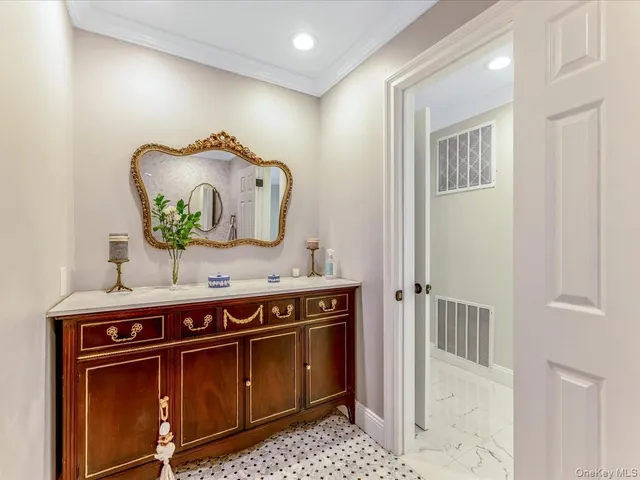 a living room with kitchen island furniture and a chandelier