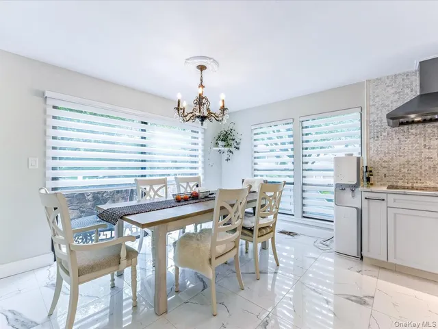 a kitchen with refrigerator and cabinets