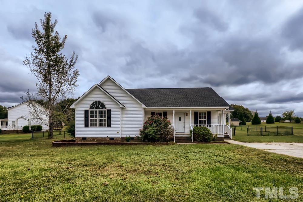 386 Rosa Circle Willow Spring, NC 27592 - Photo 1 of 27 a front view of a house with a garden